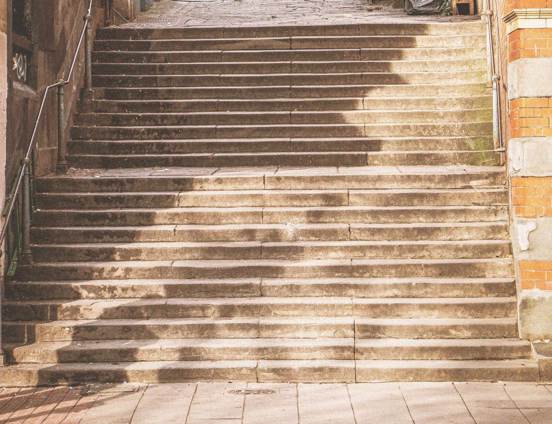 Stone steps leading up between two buildings